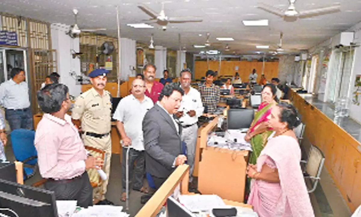 As a part of surprise inspection, Divisional Railway Manager of Waltair Anup Satpathy interacting with the staff at the Divisional Railway Manager’s office in Visakhapatnam on Wednesday