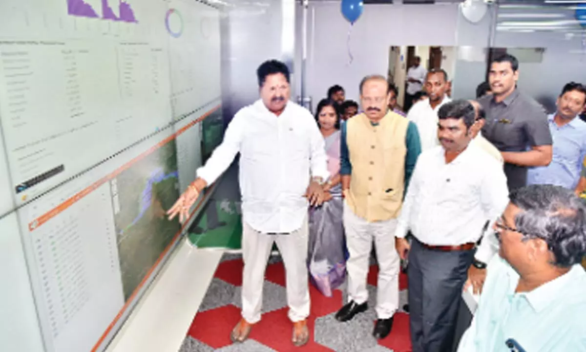 Civil Supplies Minister  Karumuri Venkata Nageswara Rao with officials at the Command Control Room in Vijayawada on Wednesday