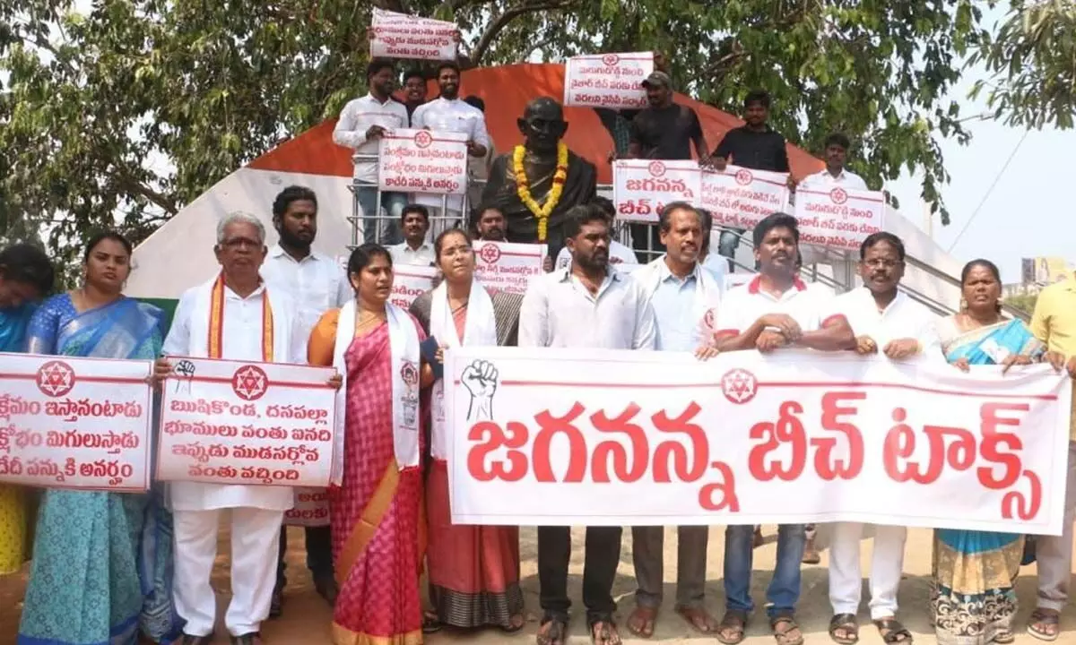 Jana Sena Party corporators staging a dharna at the Gandhi statue near GVMC office in Visakhapatnam on Wednesday