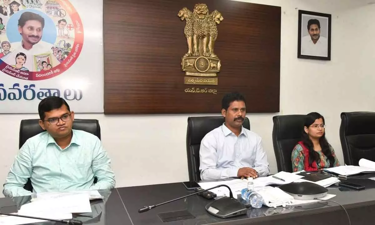 Collector S Dilli Rao and VMC Commissioner Swapnil Dinakar Pundkar participating in a videoconference in Vijayawada on Thursday