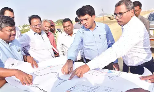 Mahabubnagar Collector G Ravi Kumar inspecting the ongoing necklace road works around Mini Tank bund in the district on Thursday
