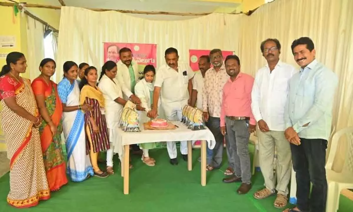 Mayor Y Sunil Rao cuts a cake marking completion of first phase Kanti Velugu in Karimnagar on Friday.