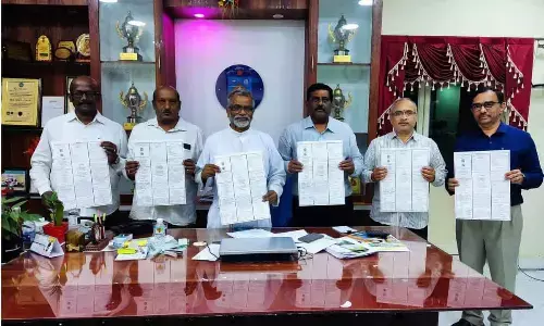 Srinivasa Sastri with IAPT-AP chapter secretary Sahay Bhaskaran, seminar director Ch Srinivasa Rao and principal Fr Kishore and convener of conference Srikar releasing a poster on Friday