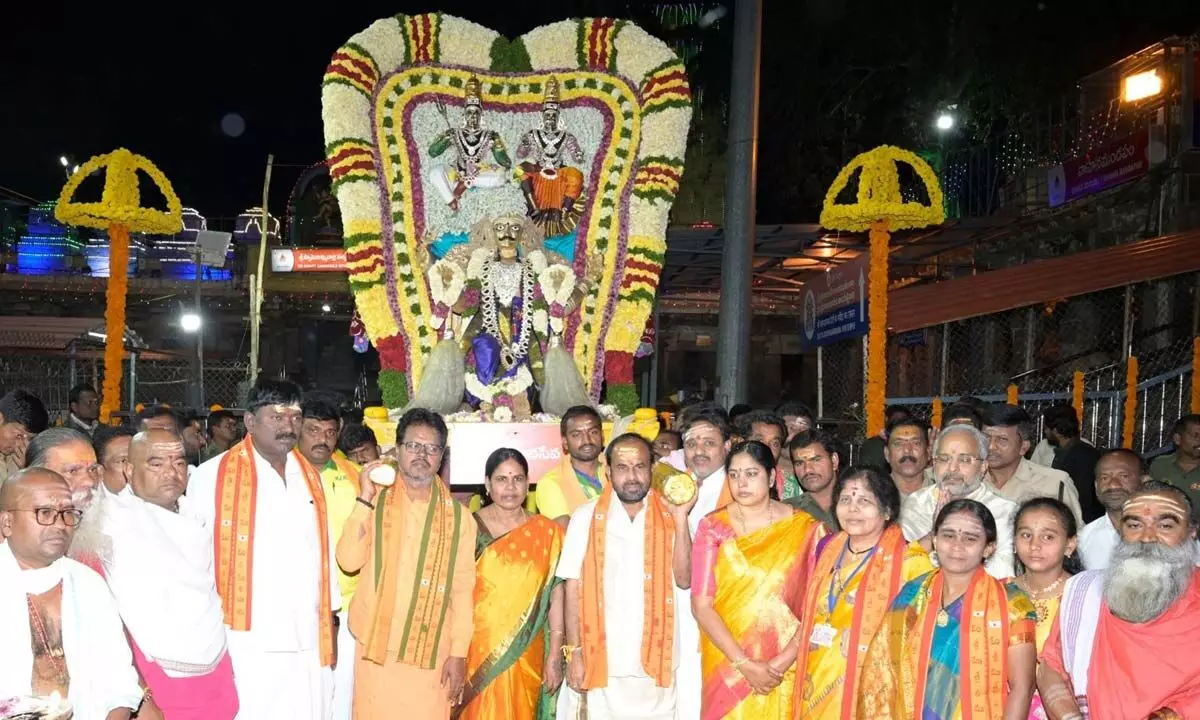 Temple Executive Officer S Lavanna and others participating in the Brungi Vahana Seva of Lord Mallikarjuna Swamy and Goddess Bramarambika Devi organised as part of Sivaratri Brahmotsavams in Srisailam on Sunday.