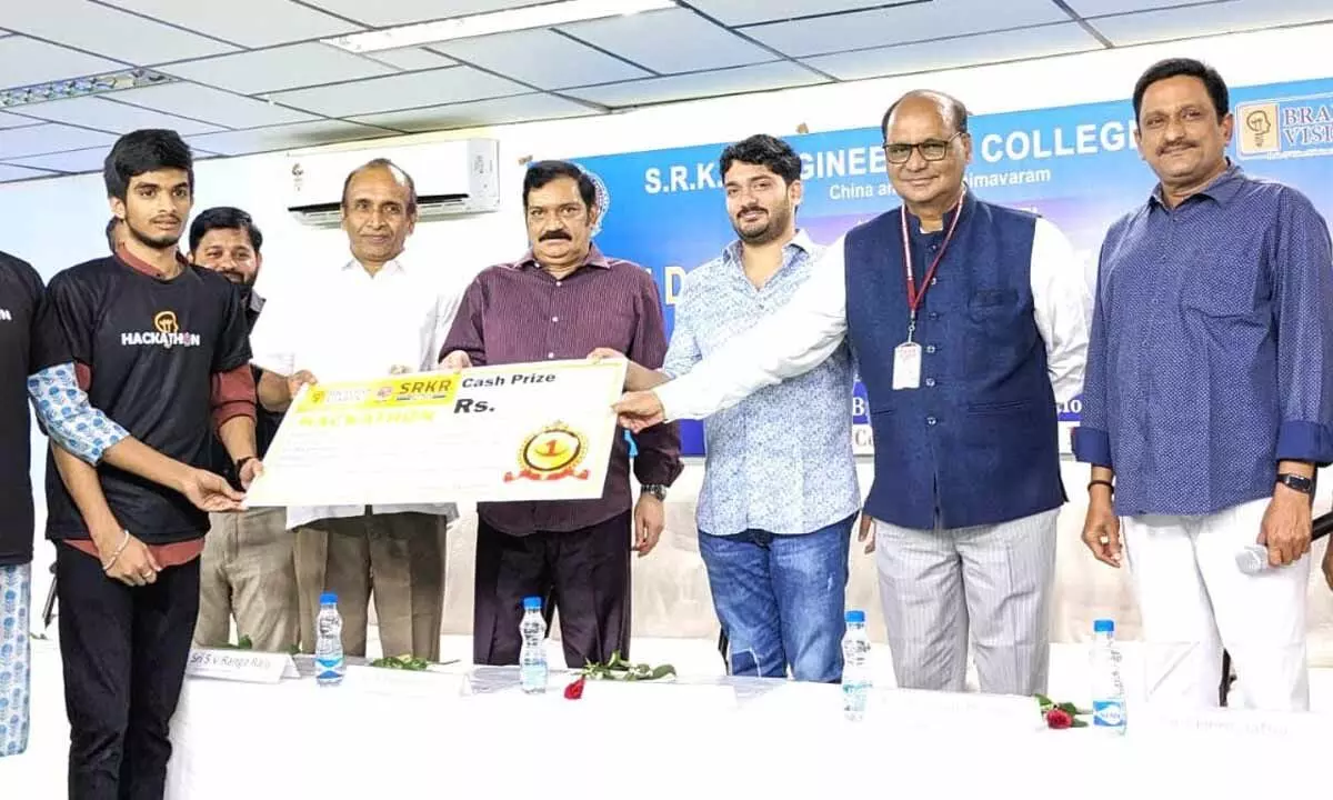 SRKR Engineering College committee vice-president SV Rangaraju presenting prizes to the winners in the Hackathon competitions on the college premises