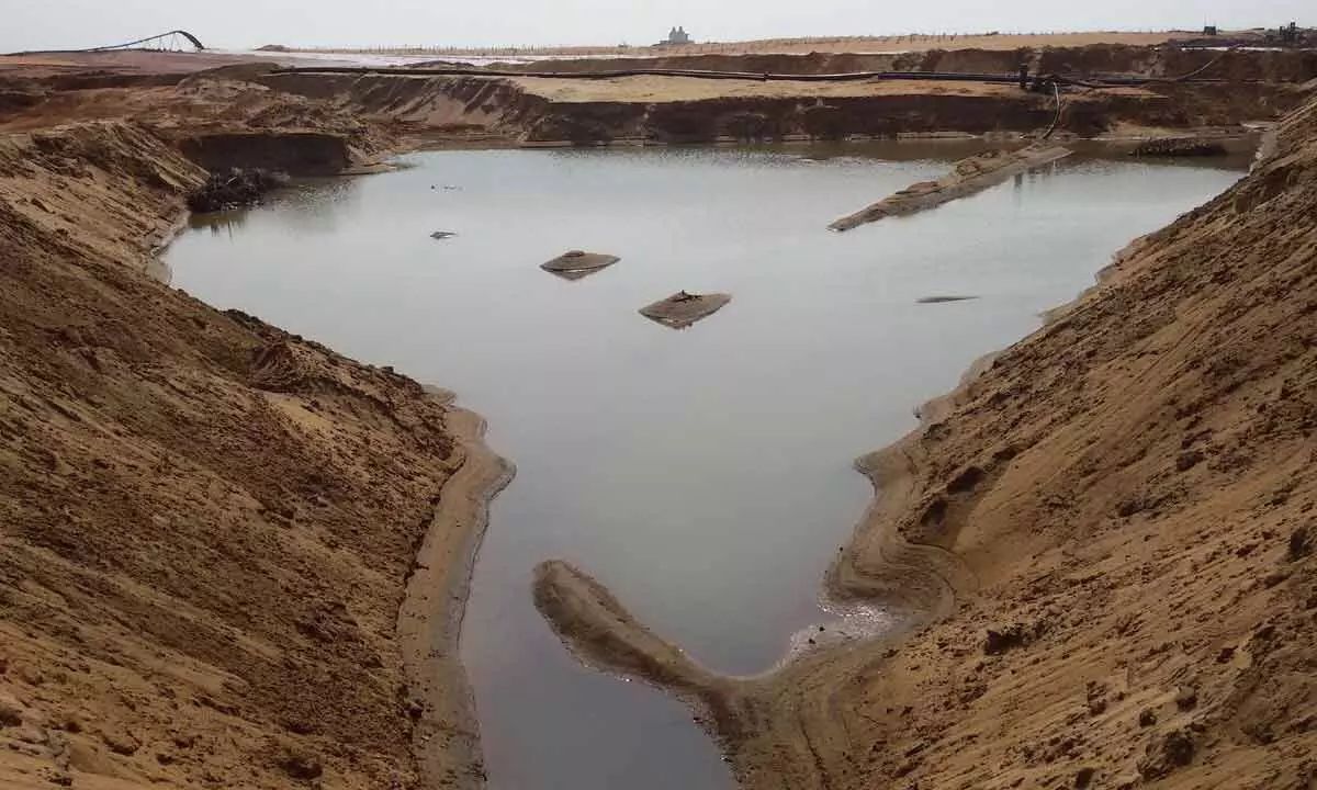 A sand mining company digging indiscriminately along the sea coast in Gara mandal