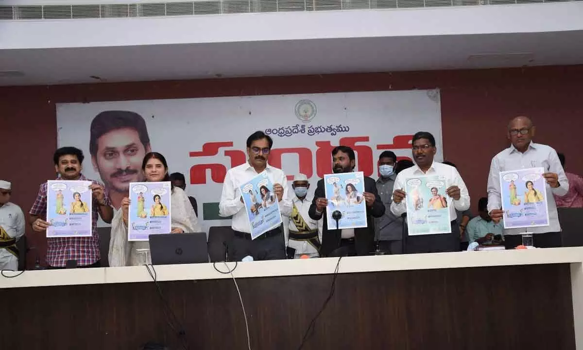 District Collector M Venugopal Reddy and Joint Collector G Rajakumari releasing posters of Financial Literacy week at a programme at AS Sankaran Hall in Guntur city on Monday