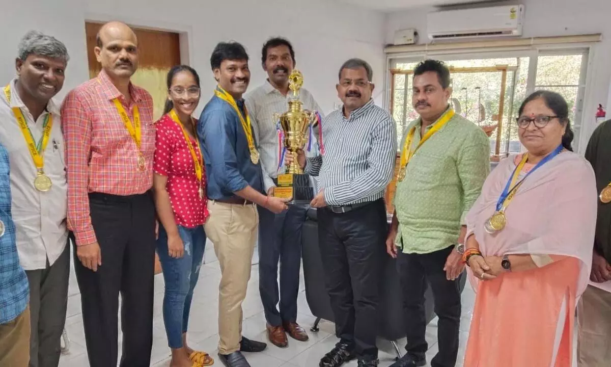 Chairman of Visakhapatnam Port Authority K Rama Mohana Rao congratulating VPSC Men and Women Shuttle Badminton team for their achievement in Visakhapatnam on Tuesday
