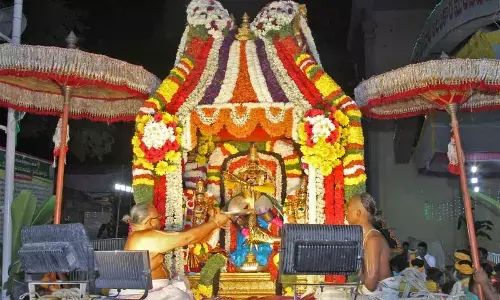 Lord Srinivasa along with His consorts Sridevi and Bhudevi blessing devotees from atop Sarvabhupala Vahanam on Tuesday evening