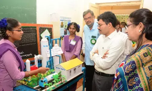 District Collector A Mallikarjuna watching one of the projects put up by the students at KDPM High School in Visakhapatnam on Tuesday