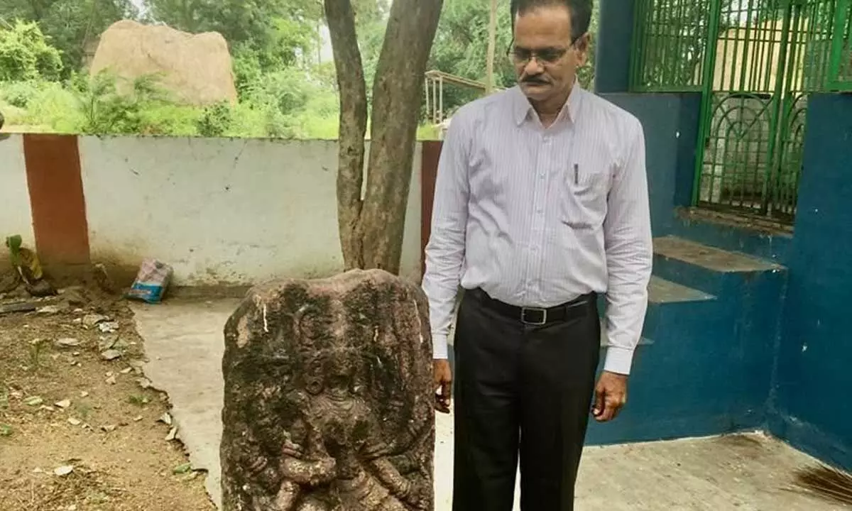Archaeologist  and CEO,  Pleach India Foundation  Dr E Sivanagi Reddy showing fourth century sculpture  at Pedakonduru