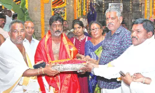 MLA Chevireddy Bhaskar Reddy presents silk clothes to Lord Srinivasa on the occasion of Garuda Vahana seva on the 5th day of ongoing Annual Brahmotsavams of Lord Kalayana Venkateswara at Srinivasa Mangapuram on Wednesday.