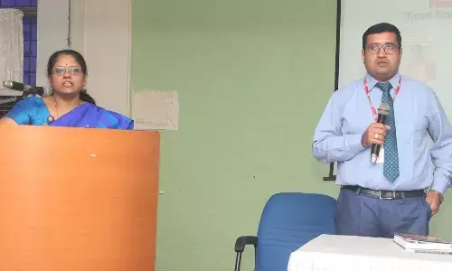 RBI officials Poornima and Subhash speaking at an awareness programme on Financial Literacy’ held for TTD employees in Tirupati on Wednesday.