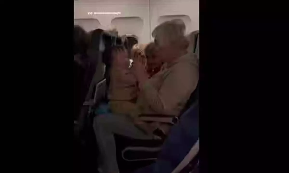 Women help baby calm down during a flight.(Instagram/@Majically)