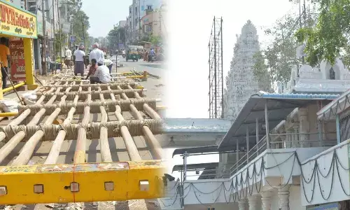 Workers preparing Prabha for the procession