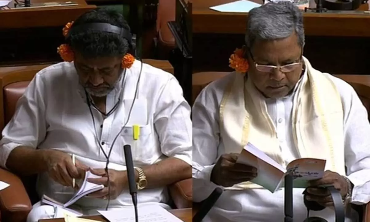 Karnataka Congress leaders attend budget session with flowers behind ears