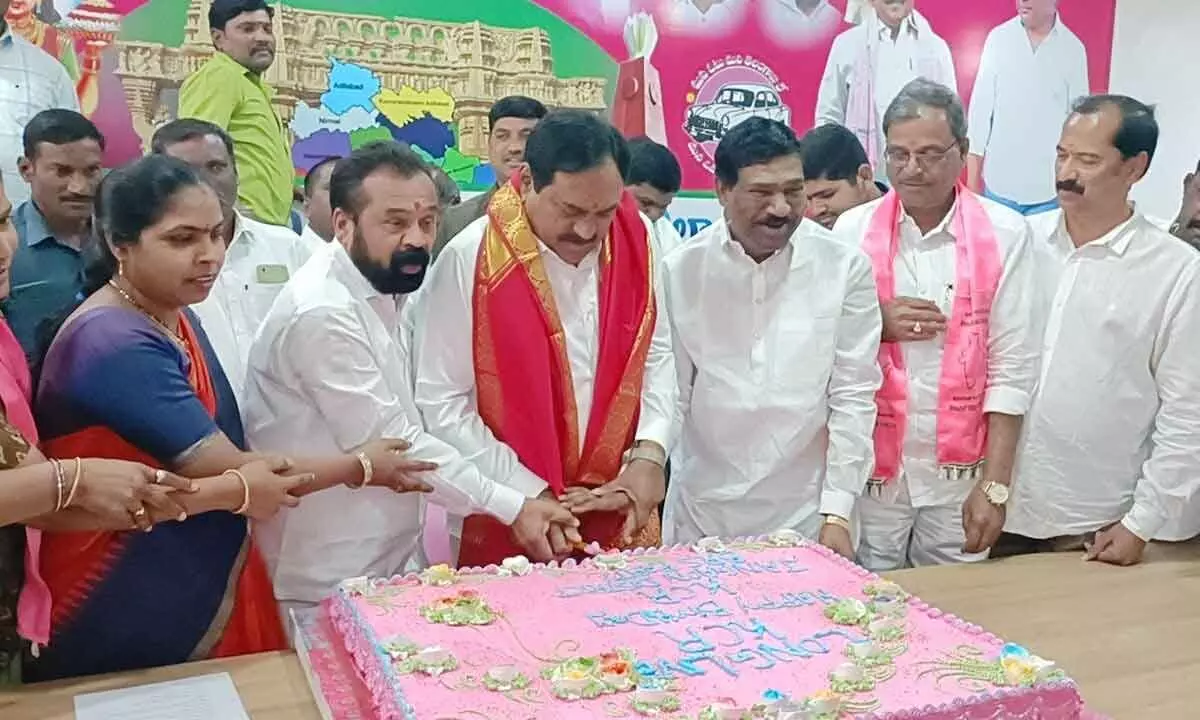Minister for Panchayat Raj Errabelli Dayakar Rao cutting a cake as part of Chief Minister K Chandrasekhar Rao birthday celebrations in Jangaon on Friday