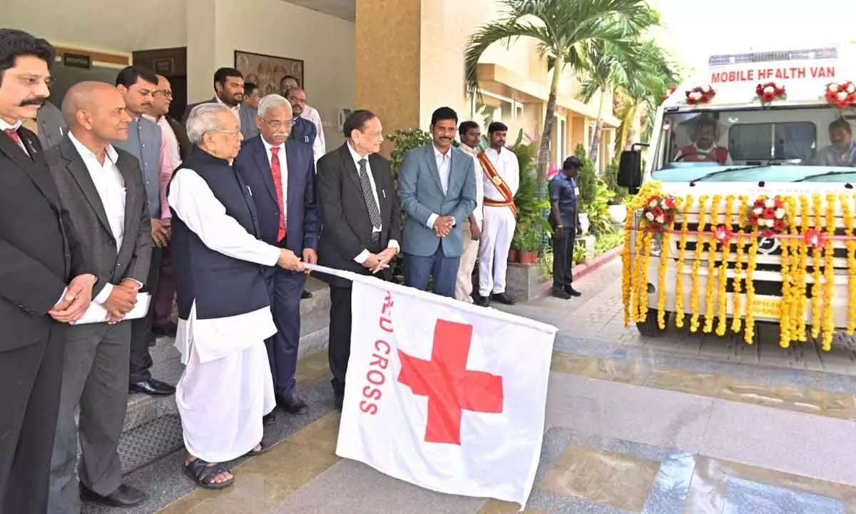 Governor Biswabhusan Harichandan flags off a mobile health van of Red Cross at Raj Bhavan in Vijayawada on Friday