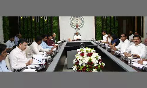 Chief Minister Y S Jagan Mohan Reddy holding a review on housing at his camp office in Tadepalli on Friday