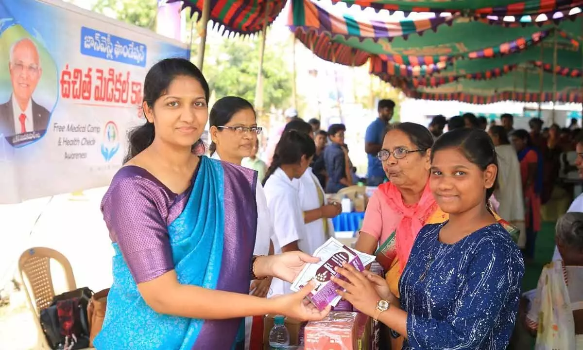 John Wesley foundation chairman Blessie Wesley distributing medicines to patients at a medical camp in Rajamahendravaram on Sunday