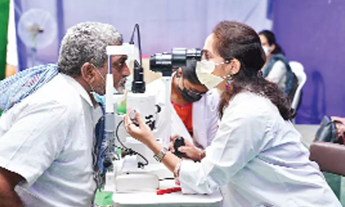 A doctor checking a patient at a free eye screening camp at Coromandel hospital in Valasapakala in Kakinada on Sunday