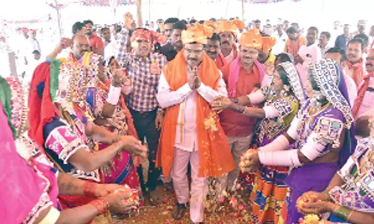 Agriculture minister Singireddy Niranjan Reddy being welcomed by the Lambada Tribal women at the Santh Sevalal birth anniversary celebrations  in Wanaparthy on Sunday
