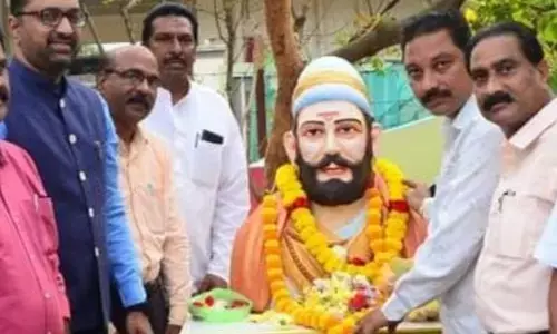 Collector Shrikesh B Lathkar along with other officials garlanding statue of Shivaji in Srikakulam City on Sunday