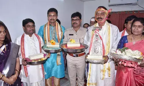 Palnadu district Collector Siva Sankar Lotheti, SP Ravisankar Reddy and MLA Dr Gopireddy Srinivasa Reddy presenting silk robes to Sri Trikoteswara Swamy on Maha Sivaratri on Saturday