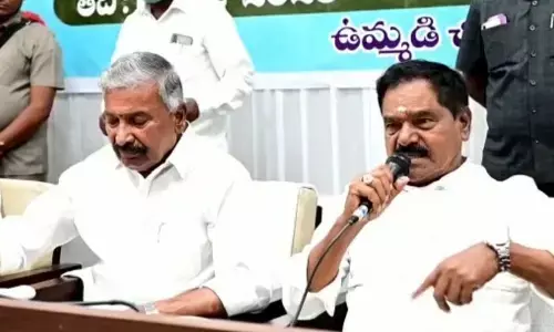 Deputy Chief Minister K Narayana Swamy addressing at ZP general body meet in Chittoor on Sunday. Energy Minister P Ramachandra Reddy is also seen.