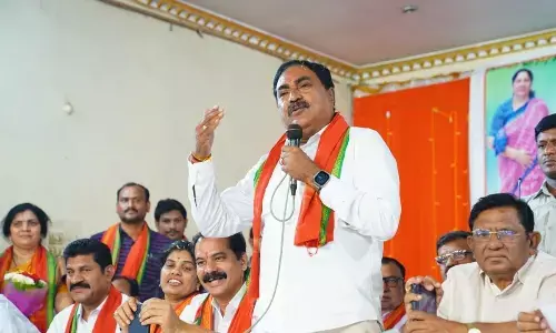 Minister for Panchayat Raj and Rural Development Errabelli Dayakar Rao speaking at the Banjara Atmeeya Sammelanam in Hanumakonda on Sunday. Chief Whip D Vinay Bhaskar is also seen.