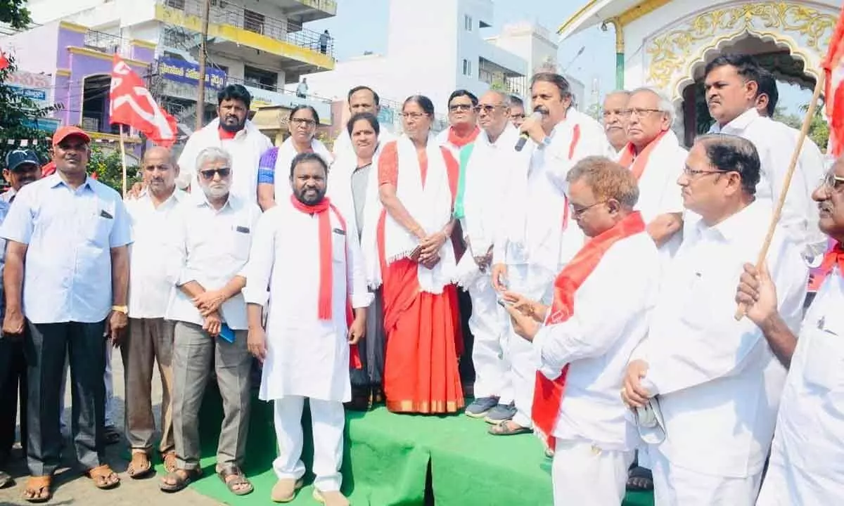 CPI State secretary K Ramakrishna speaking at Rajahmundry Road-cum-Rail bridge before leaving for Polavaram project inspection trip on Monday. Party leaders A Vanaja, R Venkaiah and others are also seen.