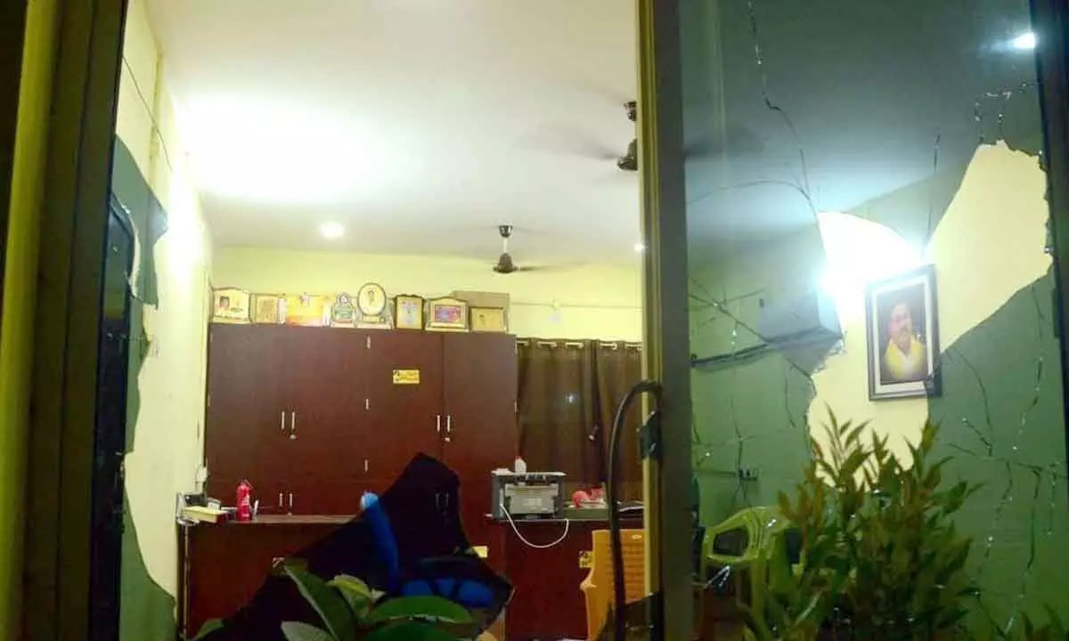 Broken furniture and glass panes of TDP office in Gannavaram on Monday