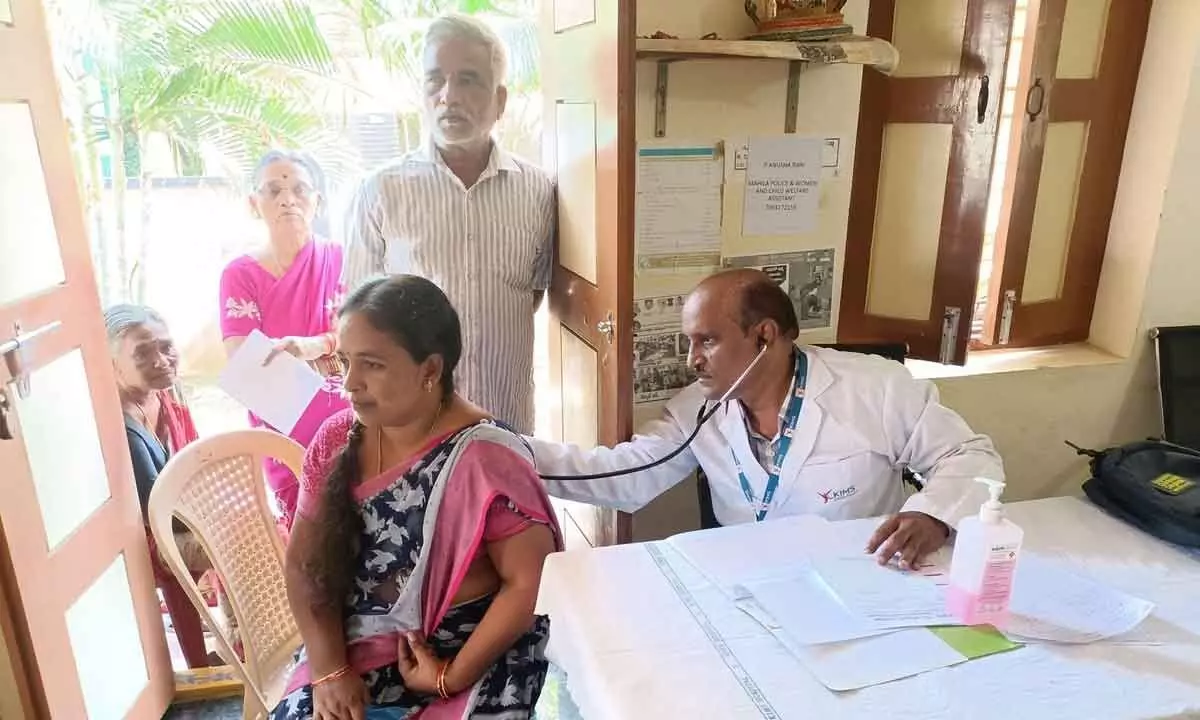 Doctor checking a patient at free  medical camp held at Ammanabrolu village on Monday