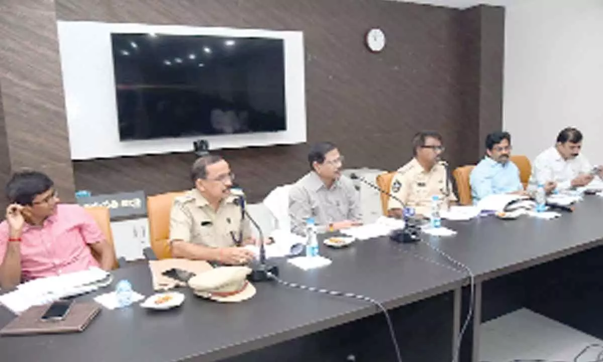 DRO M Srinivasa Rao speaking at the Road safety committee meeting in Tirupati on Monday. DTO K Seetha Rami Reddy, DSP Katama Raju and others are seen.