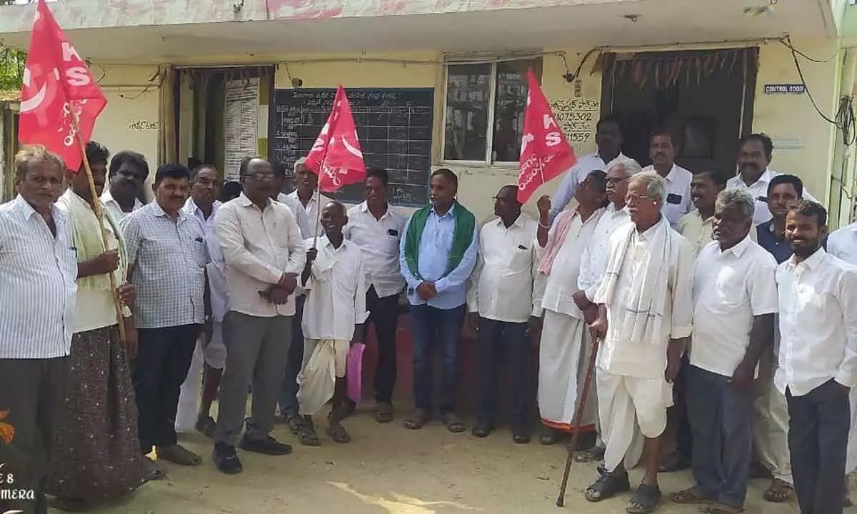 A group of farmers protesting against the government move at the TSNPDCL office at Konijeral in Khammam district on Monday