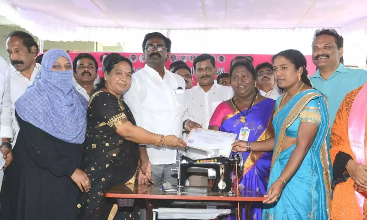 Minister for Transport Puvvada Ajay Kumar distributing sewing machines to women in Khammam on Monday