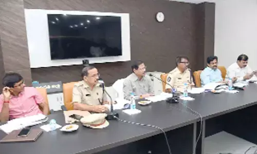 DRO M Srinivasa Rao speaking at the Road safety committee meeting in Tirupati on Monday. DTO K Seetha Rami Reddy, DSP Katama Raju and others are seen.