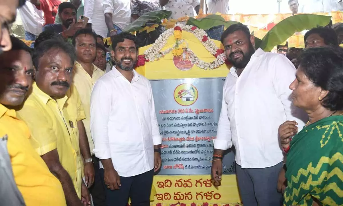 TDP national general secretary Nara Lokesh unveiling a plaque to mark the completion of 300 km of his padayatra in Srikalahasti on Tuesday