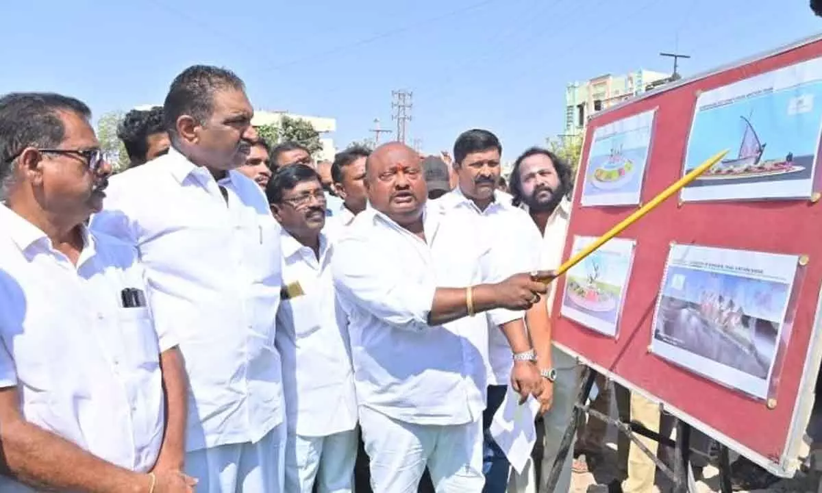 Minister G Kamalakar inspecting traffic islands works in Karimnagar on Tuesday