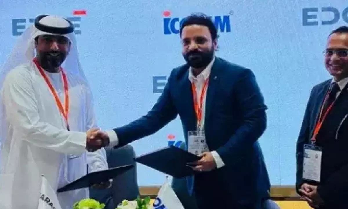 Caracal CEO Hamad Al Ameri and ICOMM Managing Director Sumanth P exchanging the licensing agreement documents