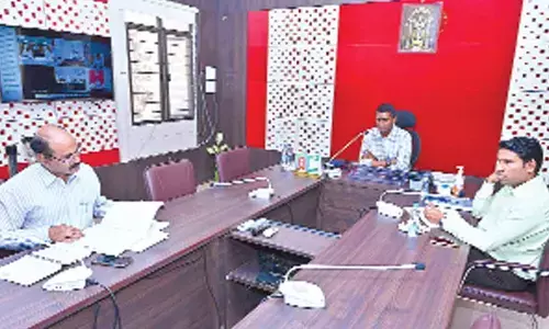 Chittoor Collector M Hari Narayanan holding a video-conference with other district Collectors and officials on MLC elections on Tuesday. Joint Collector   Dr S Venkateswar and DRO N Rajasekhar are also seen.