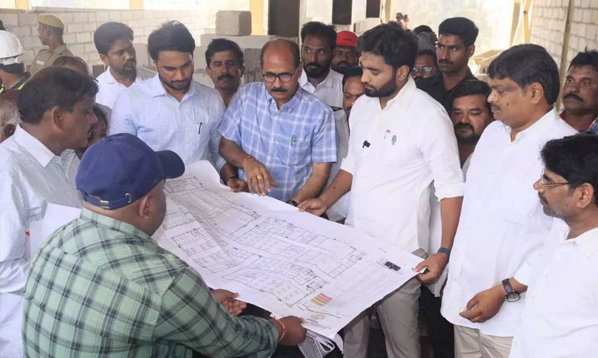 MP Margani Bharat Ram examining the construction plan of the Government Medical College in Rajahmundry on Tuesday