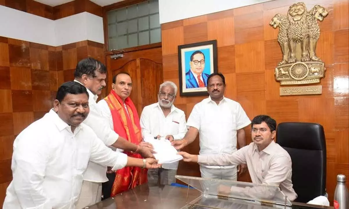 Accompanied by ministers and regional coordinator YSRCP MLC candidate Seethamraju Sudhakar filing nomination at Collectorate in Visakhapatnam on Wednesday