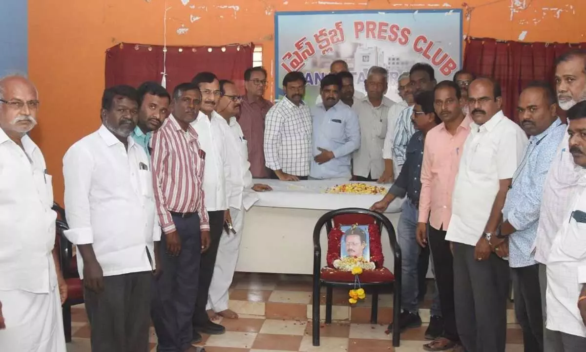 Journalists paying tributes to the portrait of senior journalist Raghu Kishore at a condolence meeting held at the Press Club in Anantapur on Wednesday