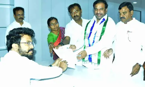 Former Jammalama dugu MLA Ponnapureddy Rama Subba Reddy filing nomination papers as MLC candidate for local bodies election on behalf of YSR Congress party in Kadapa on Wednesday. 