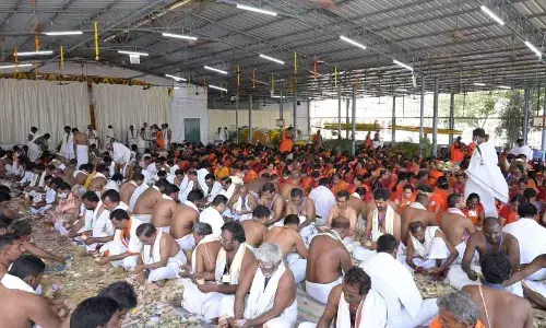 The temple staff of Sri Bramarambika Mallikarjuna Swamy temple in Srisailam counting the hundi collections on Wednesday