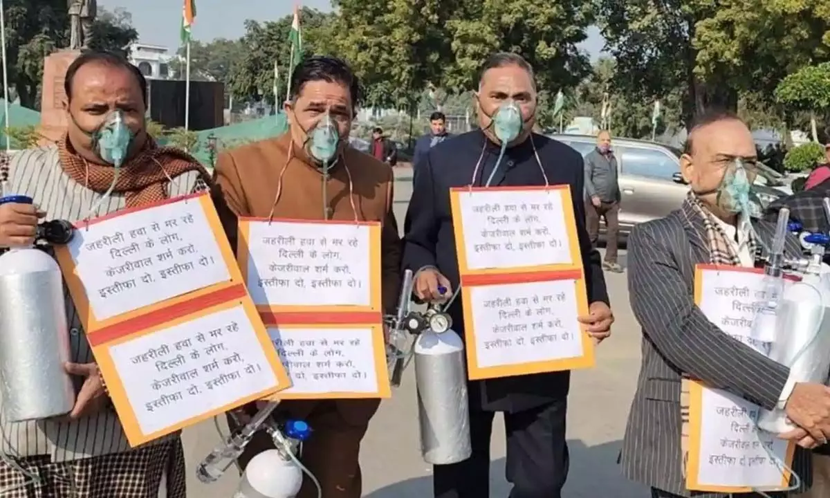 BJP MLAs Can Be Seen Carring Oxygen Cylinders And Gas Masks With Them