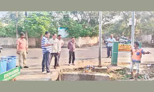 KMC Additional Commissioner Ch Naga Narasimha Rao inspecting de-siltation works in Kakinada on Thursday