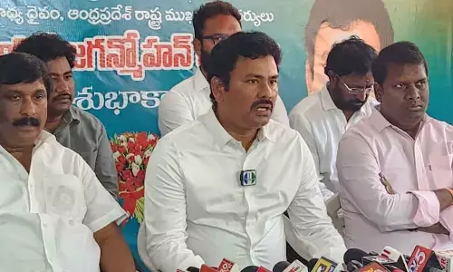 NREDCAP Chairman KK Raju speaking to the media in Visakhapatnam on Thursday