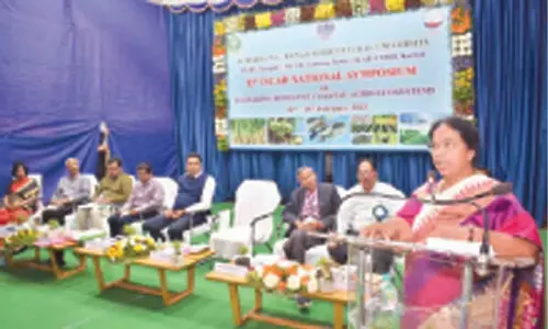 ANGRAU Director of Research Dr L Prasanthi addressing the valedictory session of national symposium in Tirupati on Friday